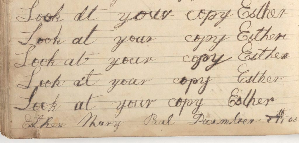 And old piece of paper with cursive writing on it. It reads: "Look at your copy esther" 5 times. Text at the bottom of the page reads: "Esther Mary Paul December 7th"