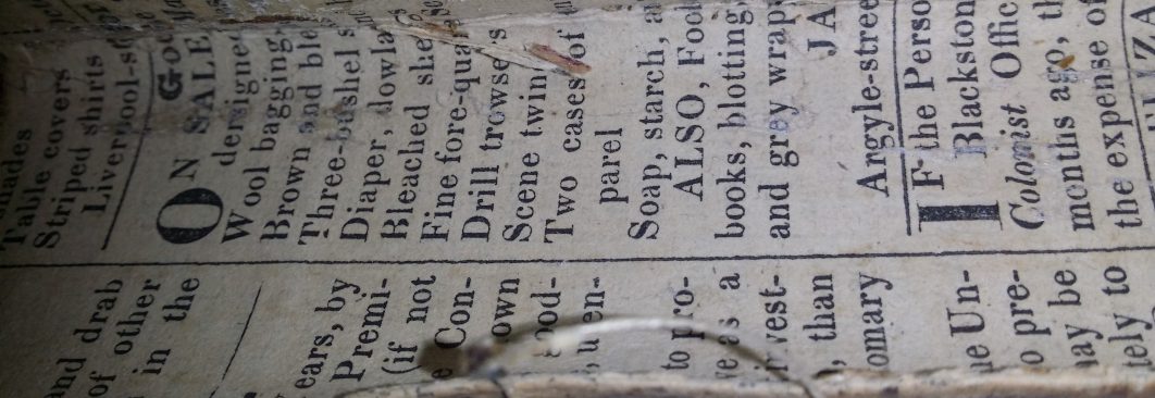 Old paper text used as binding for a book.