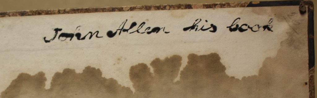 Inscription inside a book. Text reads: "John Allen his book"