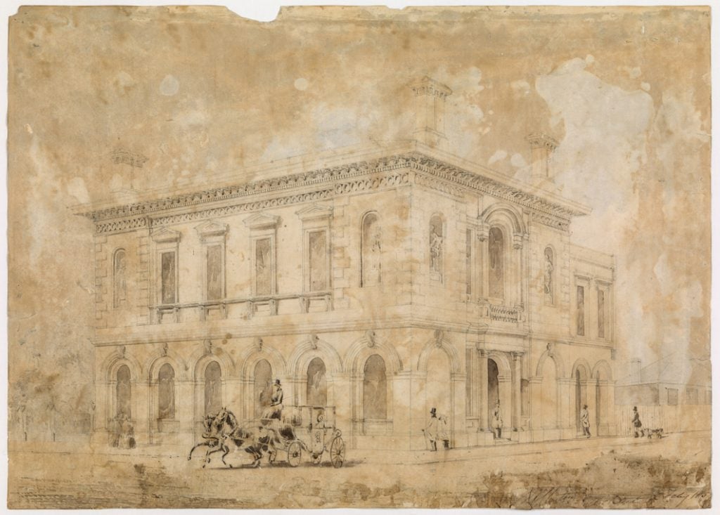 Building exterior with horse drown carriage.