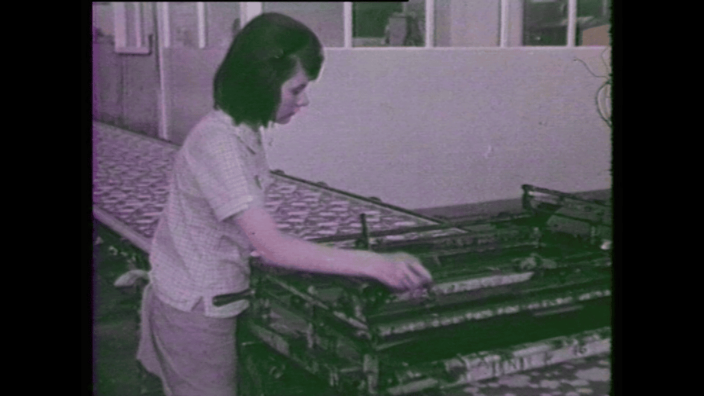 A woman working with machinery.