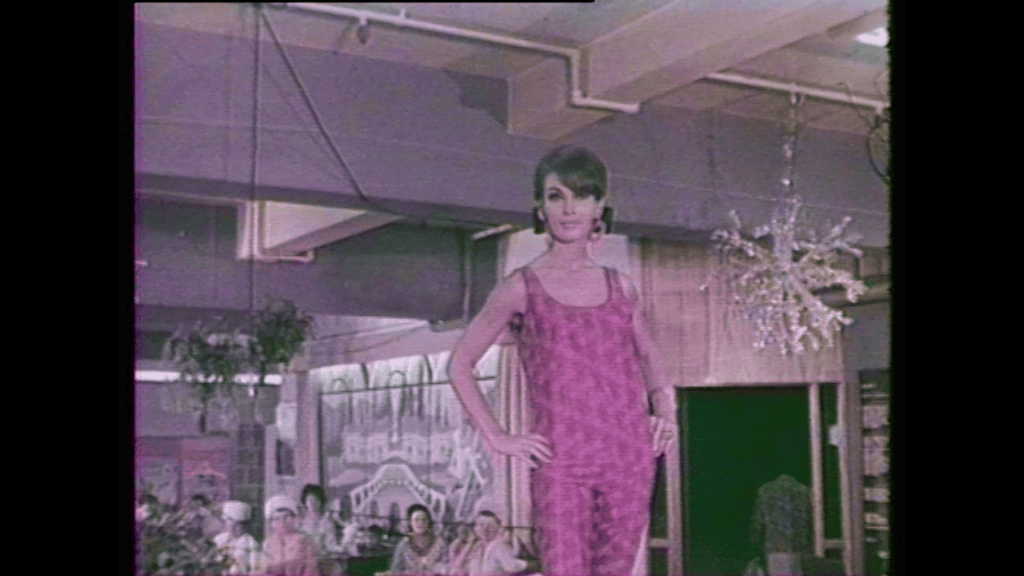 a still taken from Film More Than Apples. A woman posing with her hands on her hips