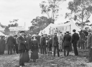 An old black and white photo of a crowd of people at a show.