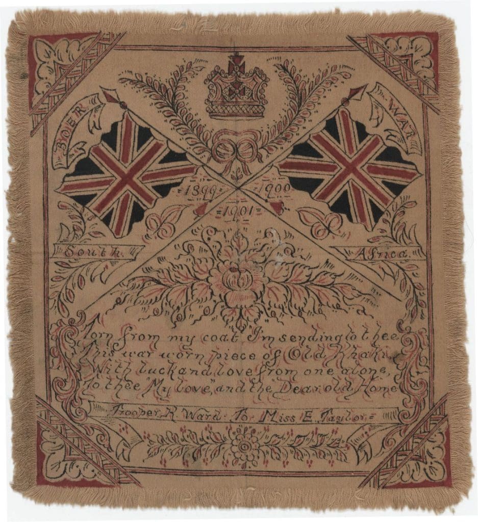 A wart tunic. it shows a crown and two British flags with an inscription.