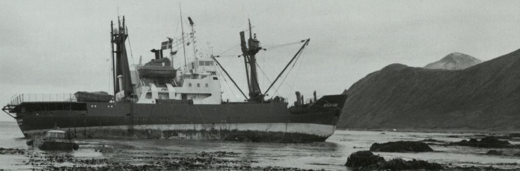 A black and white photo of a metal ship.