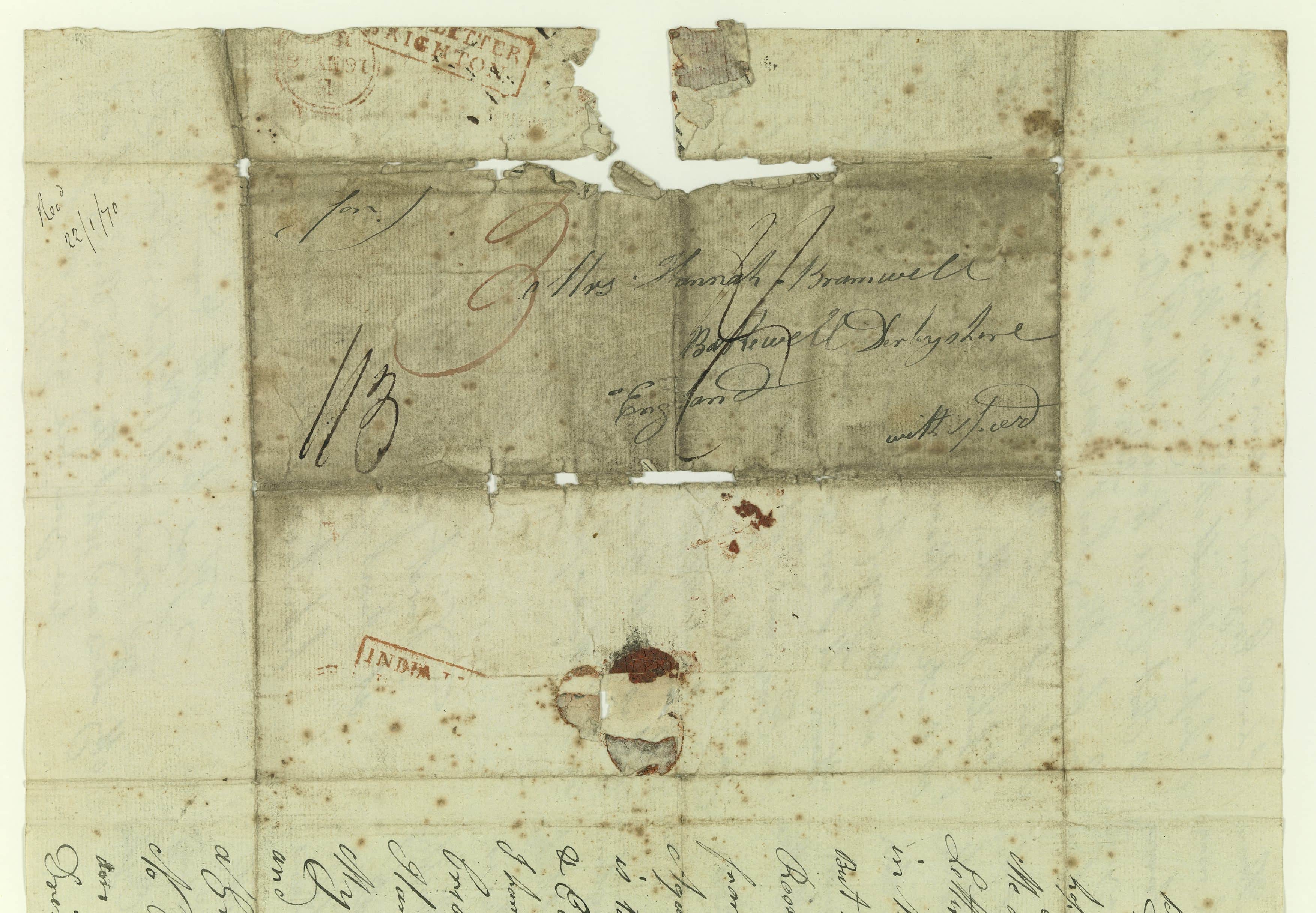 An old piece of paper with cursive text on it. Text illegible.