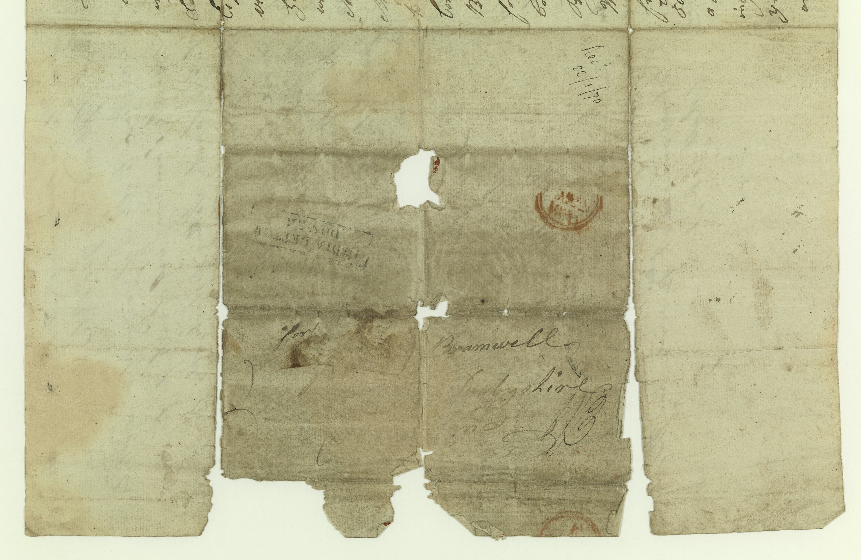 An old piece of paper with cursive text on it. Text illegible.