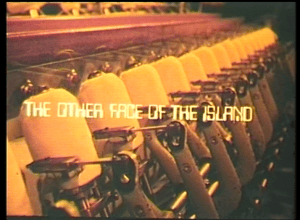 a still taken from Film – The Other Face Of The Island. Textiles machinery