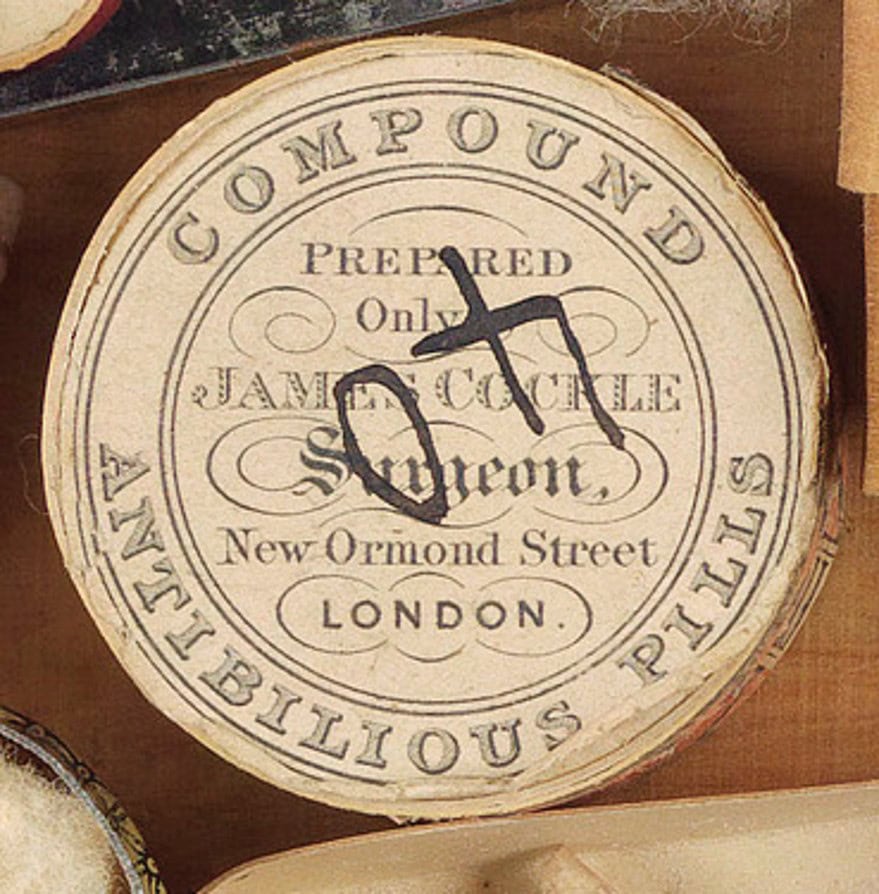 A round container - Imported antibilious pills for a distressed digestion - repurposed to house shells.