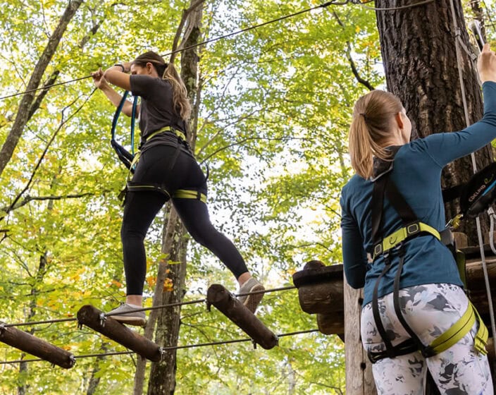 women completing ropes course