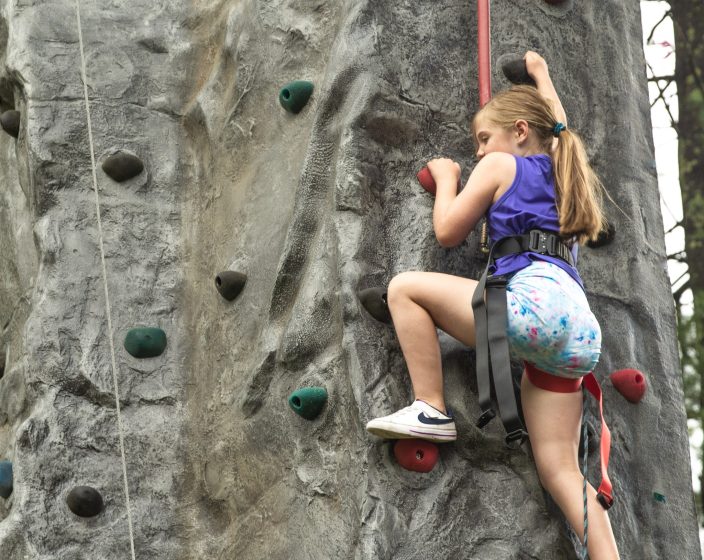 Little girl rock climbing