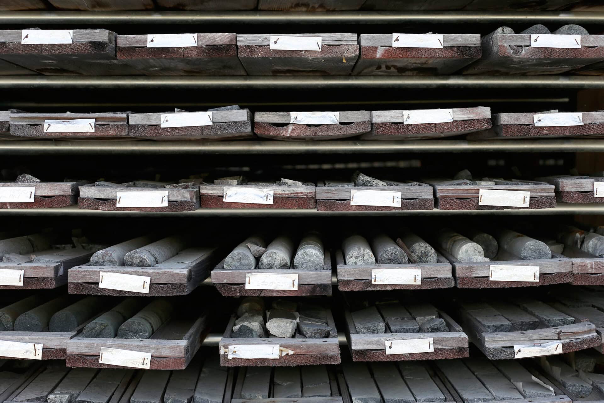 A close-up view of pallets of core samples stacked a mineral exploration site in Nopiming Provincial Park