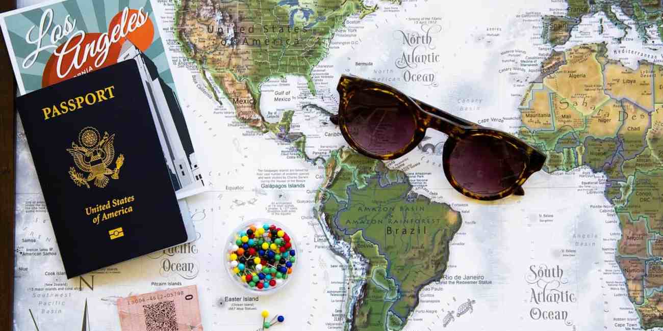 brown framed sunglasses on map