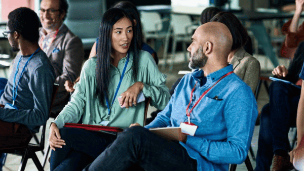 Group of people talking in a professional workshop.