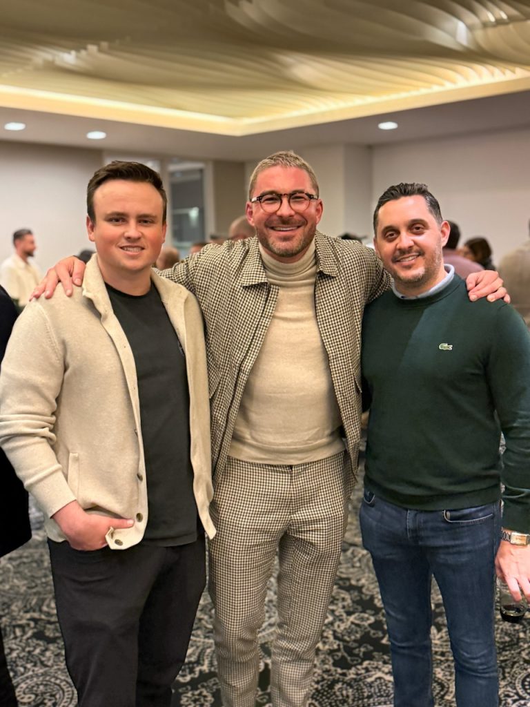 Three men posing together at The American Question industry screening reception in Beverly Hills