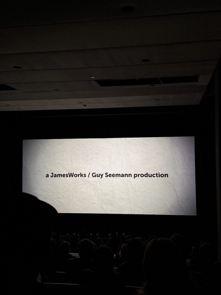 Projection screen displaying 'a JamesWorks / Guy Stancovski production' credit at UTA screening in Beverly Hills
