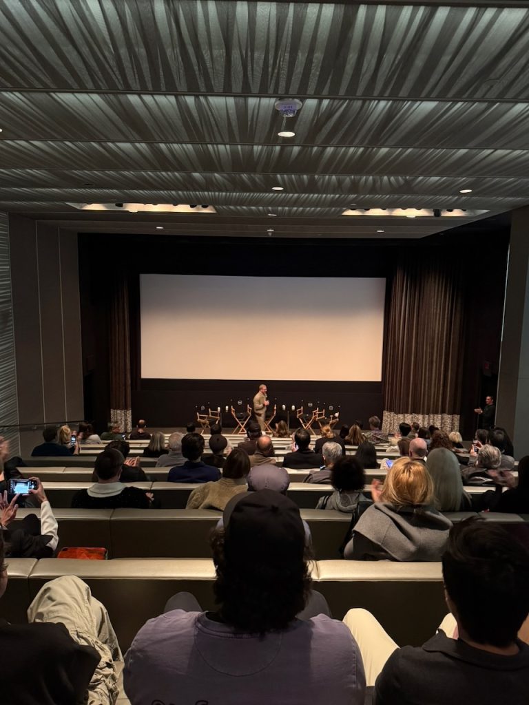 Audience members seated in theater before screening of The American Question at United Talent Agency, Beverly Hills