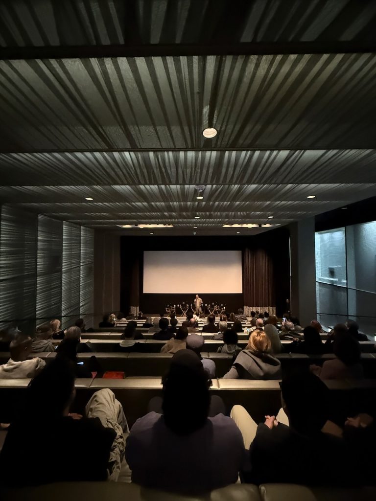 Audience seated in theater for The American Question screening at United Talent Agency, Beverly Hills, December 2024