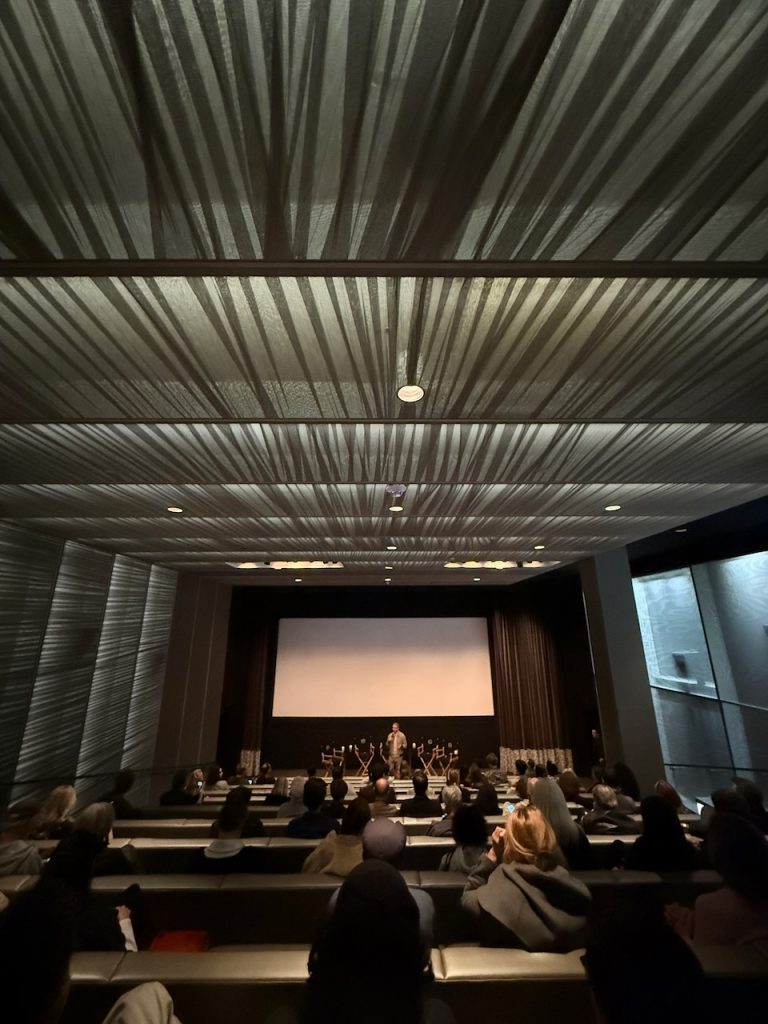 Audience gathered in a modern theater for The American Question screening, Beverly Hills, December 2024