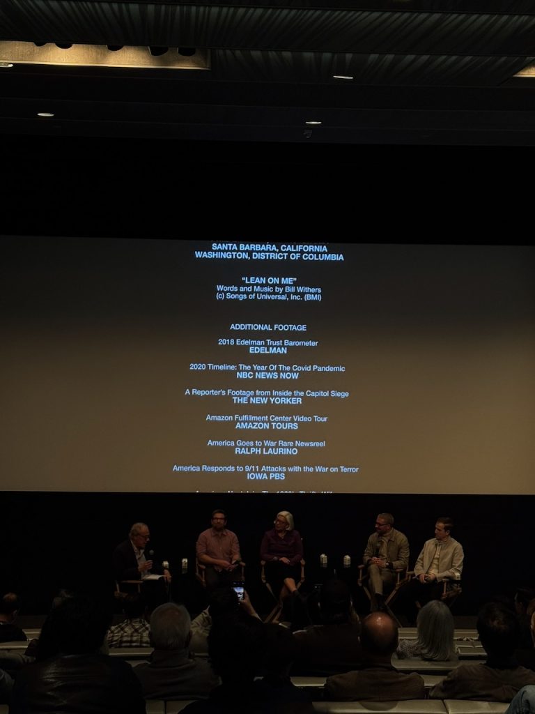 Director James Kicklighter seated in theater as end credits roll during The American Question industry screening