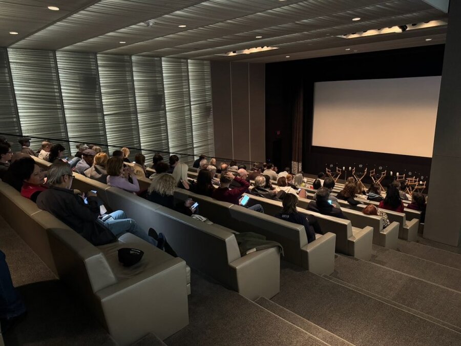 Audience seated in theater rows facing screen at The American Question screening, Beverly Hills, December 2024