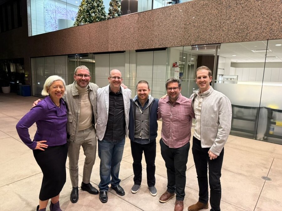 Six attendees pose together at United Talent Agency's Beverly Hills screening venue for The American Question