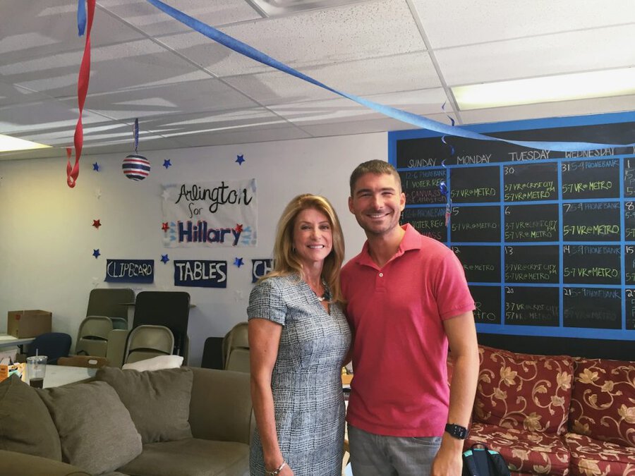 James Kicklighter and Wendy Davis standing together in Hillary Clinton 2016 campaign office with volunteer board visible behind them