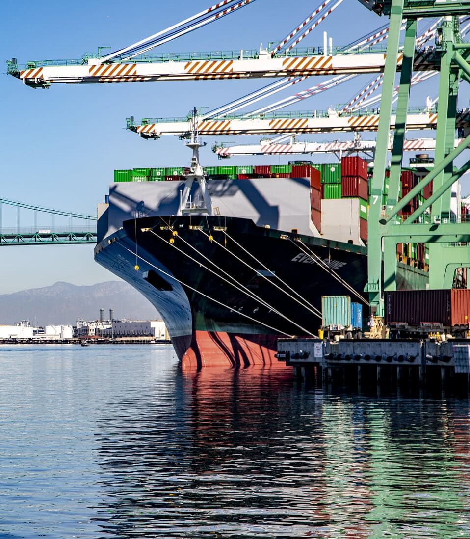 The Vincent Thomas Bridge and cargo ship at the Port of Los Angeles