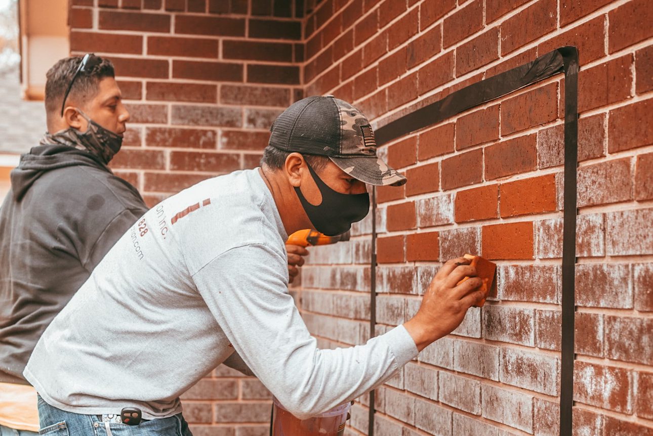 brick restoration mason crew working