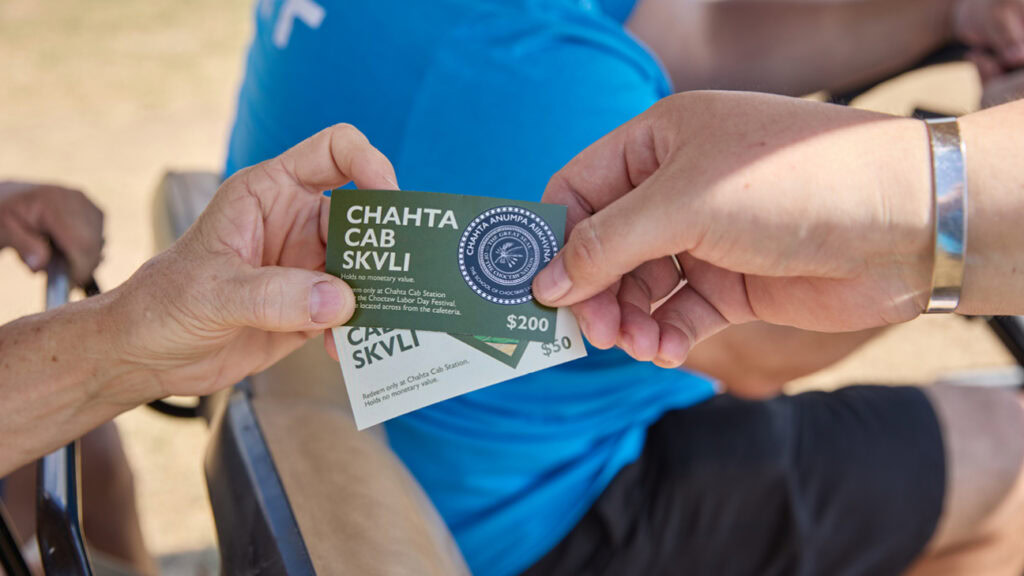 Handing out a Chahta Cab card
