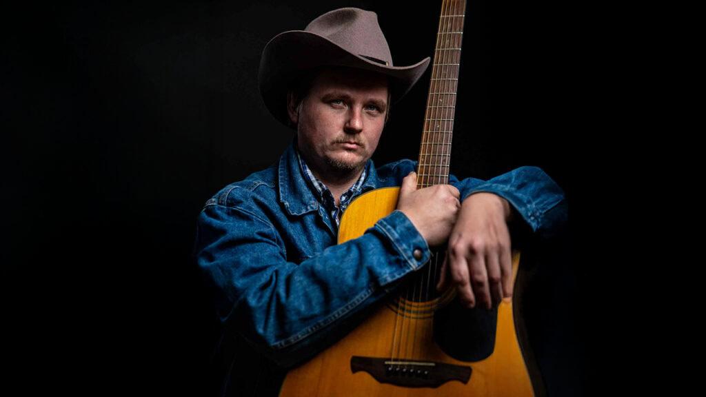 Vernon Johnson with his guitar