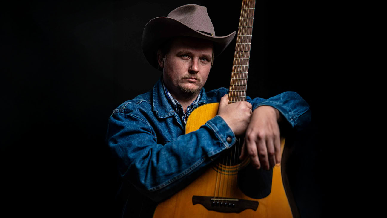 Vernon Johnson with his guitar