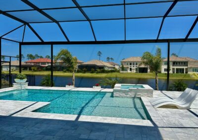 This swimming pool is right on the water making this enclosure the perfect spot to relax during the summer.