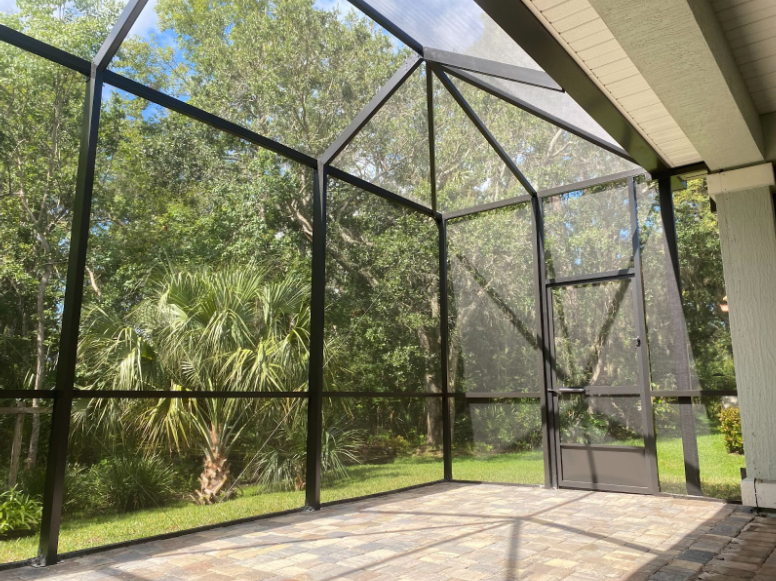 This beautiful screen enclosure provides extra space for the homeowners to entertain in their backyard. 