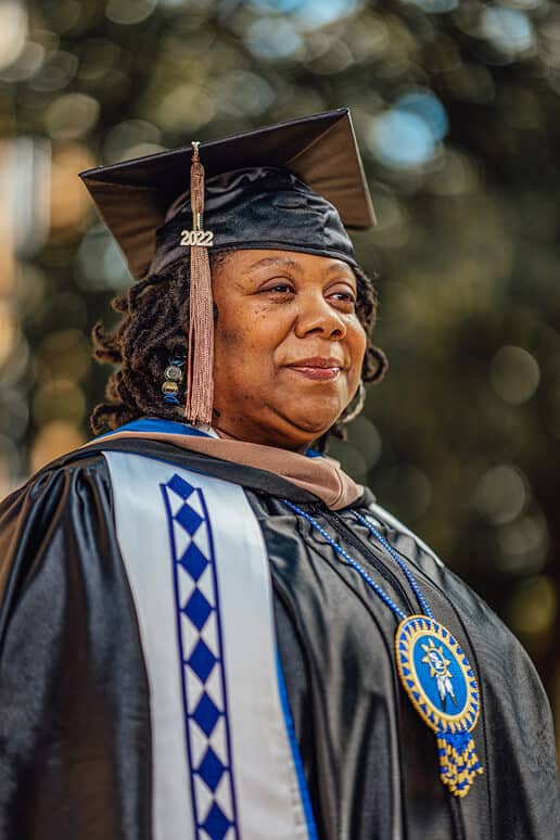 Shanna Douglas smiles in her graduation robes