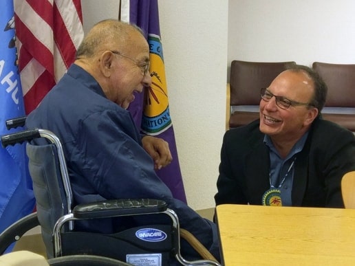 Chief Batton speaking with tribal member Houston Baker