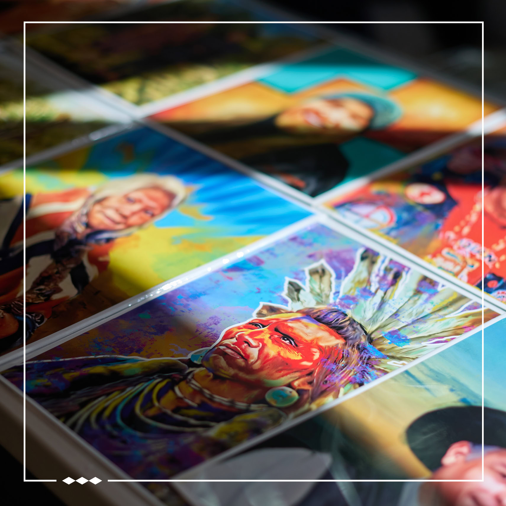 a collection of art by Bobby Von Martin. The photo is inlaid with a white border. Three diamonds are in the bottom left corner of the border.