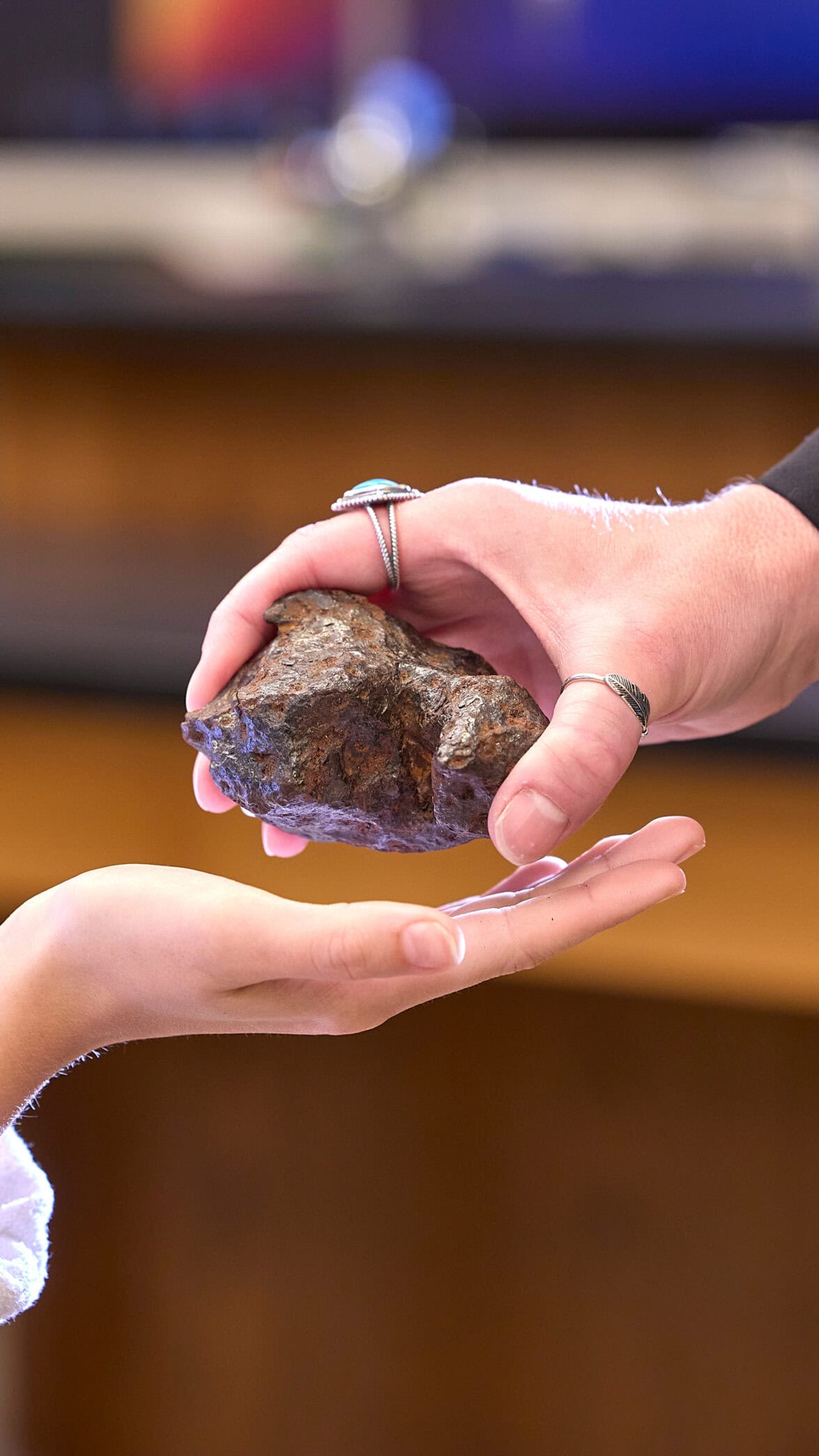 handing a photo with a rock