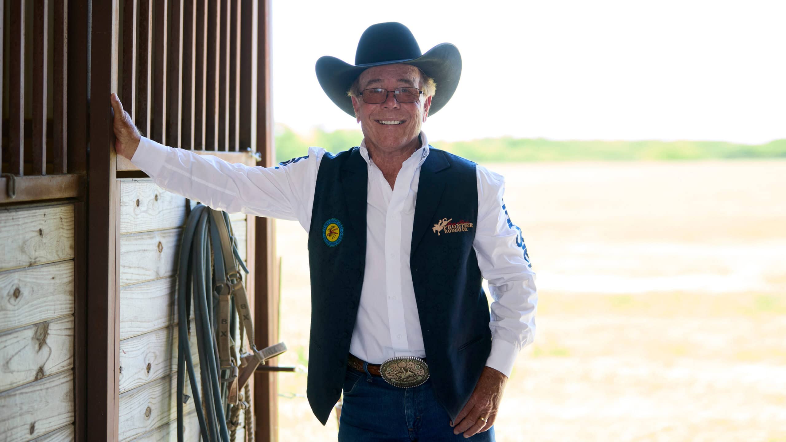 Picture of Don leaning on barn door.