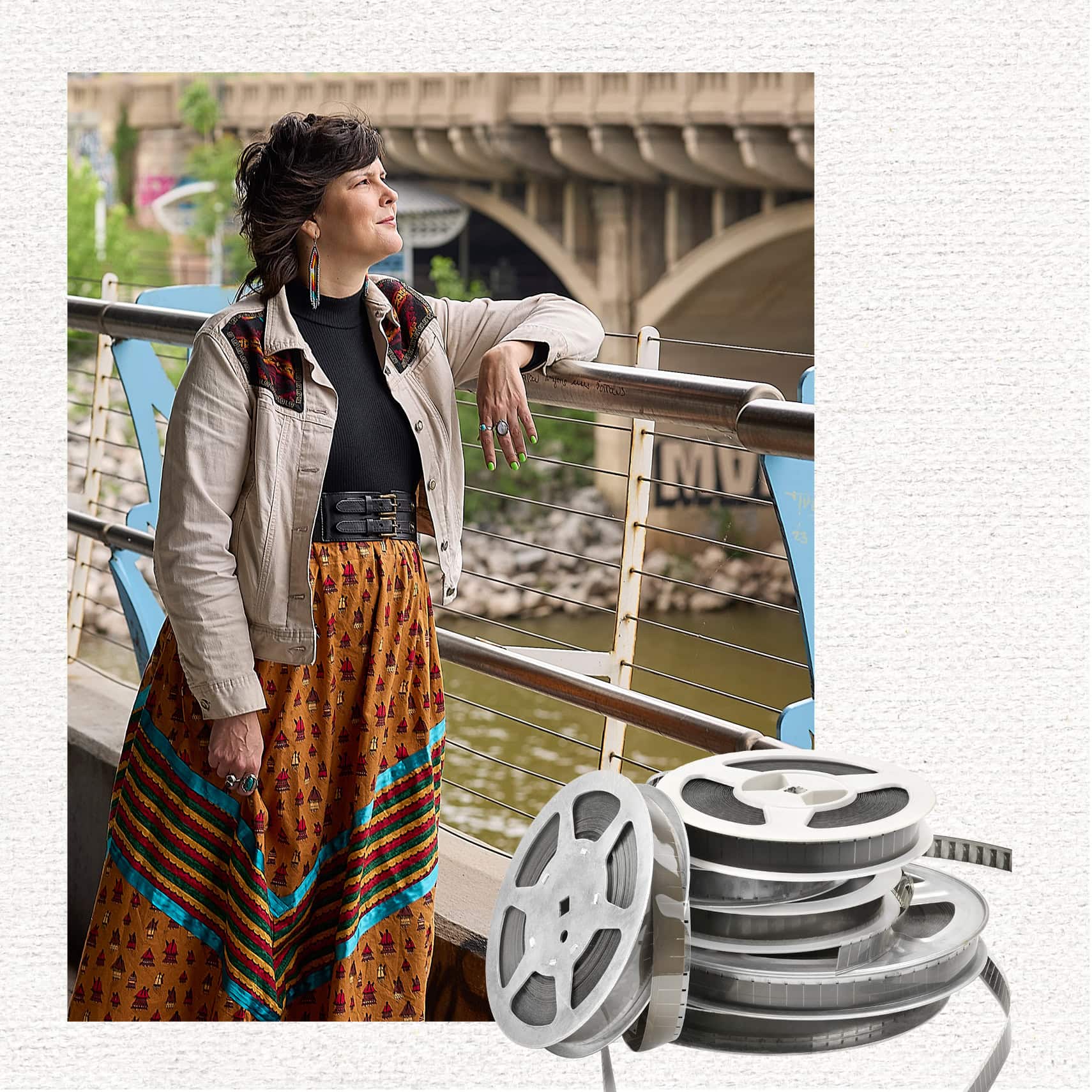 Colleen Thurston looking out across a river with a roll of film.