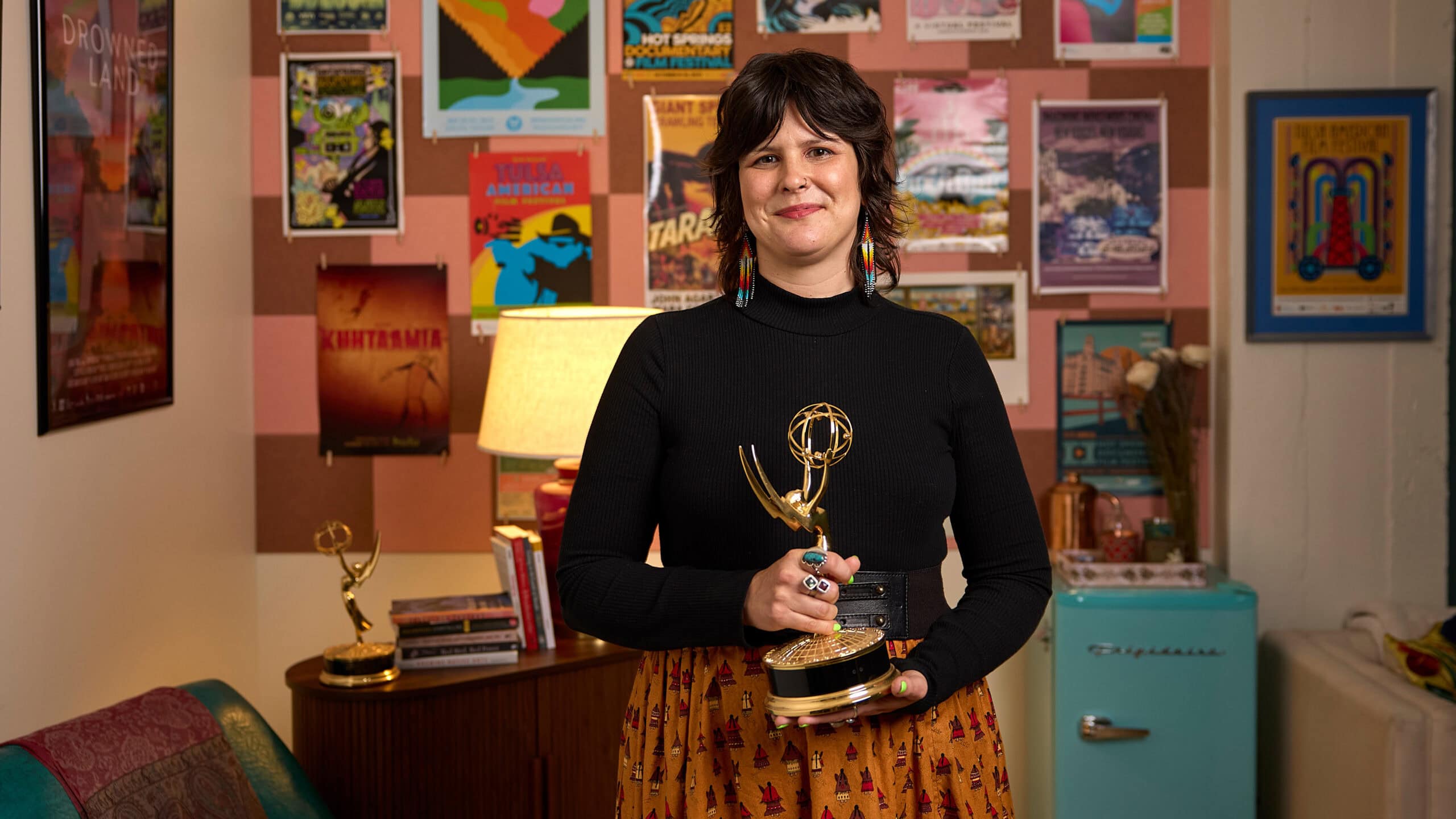 Colleen Thurston holding her award and describing her story.