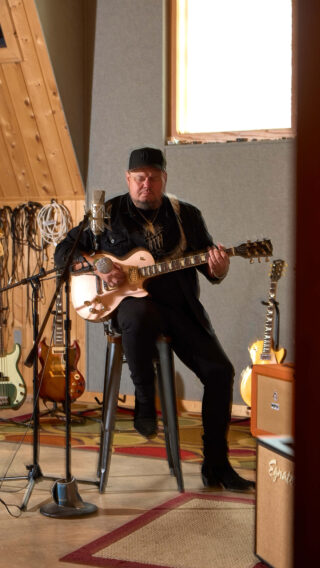 Joey Green playing his guitar.