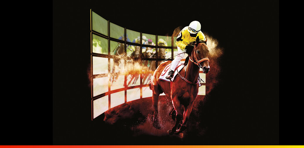 A man racing on a horse