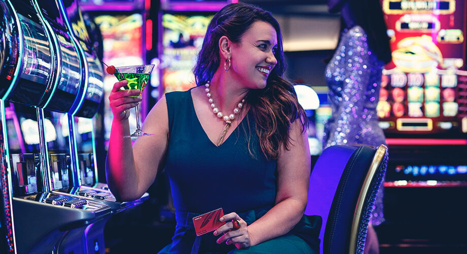 Woman sitting in a casino with a drink