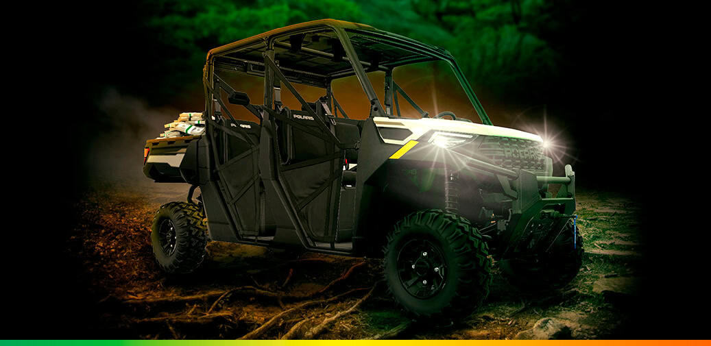 Two images of a black four-seat off-road vehicle with its headlights shining.