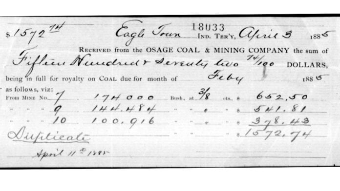 An image of a check from 1885 showing a payout of $157.