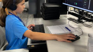 A student working on a computer.