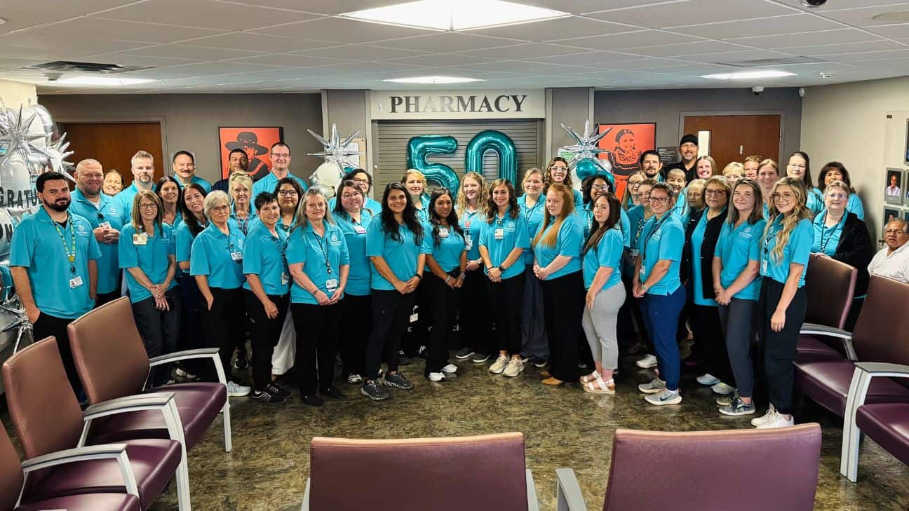Associates, health team leadership and Indian Health Services (IHS) leadership celebrating 50 years of service at the Hugo Health Clinic.