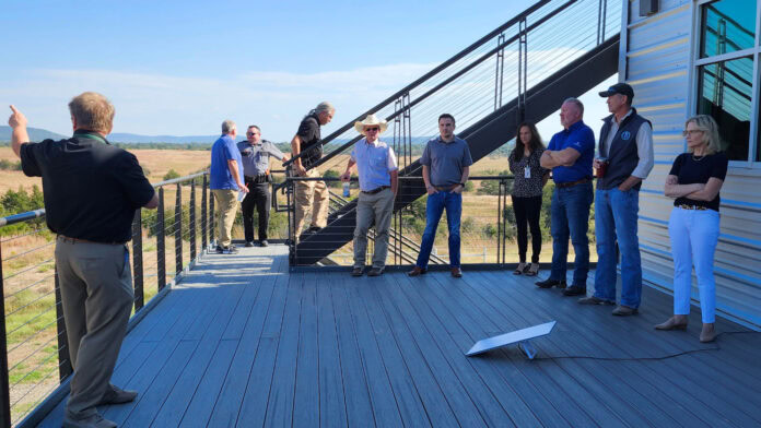 Oklahoma representatives at Daisy Ranch listen to a presentation from James Grimsley, the Choctaw Nation of Oklahoma’s executive director of advanced technology initiatives.