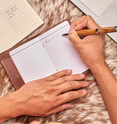 Writing in Chahta in a notebook.